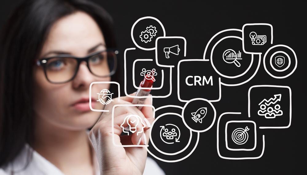 a woman drawing a diagram of an emr