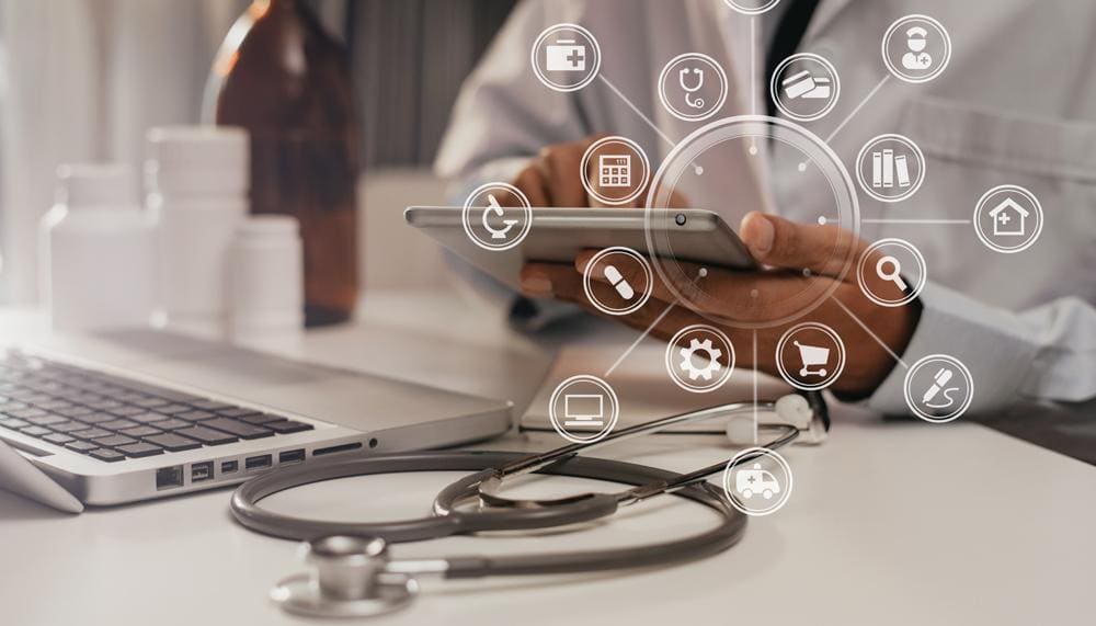 a doctor is using a tablet with medical icons surrounding it