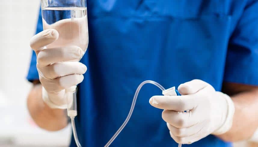 a nurse is holding an iv drip