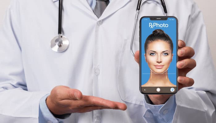 a doctor is holding a cell phone with a picture of a woman on it